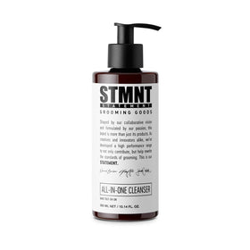 STMNT All-In-One Daily Cleanser bottle pouring for full body and hair cleanse.