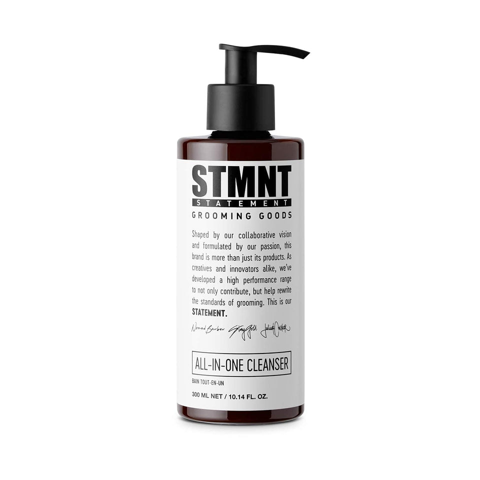 STMNT All-In-One Daily Cleanser bottle pouring for full body and hair cleanse.