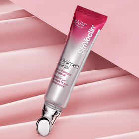 Close-up of StriVectin eye cream applied to the under-eye area showing smoothing effect.