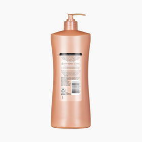 Suave Bonding Infusion Repairing Shampoo four-pack on shelf.
