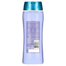 Suave bottle close-up demonstrates moisturizing lather after shower.