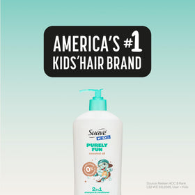 Child holding Suave Kids Purely Fun 2-in-1 bottle after bath