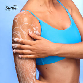 Glycerin droplets highlight moisture in Suave Vanilla Suede Exfoliating Scrub + Wash