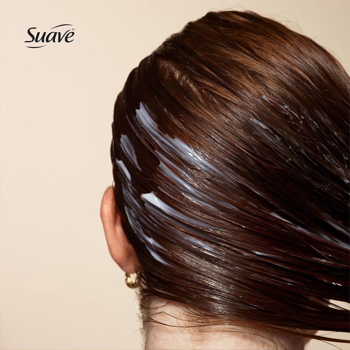 Conditioner being applied for easy detangling with Suave
