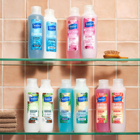 Family-size Suave Cherry Blossom bottles in a bathroom setup