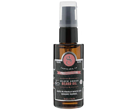 Suavecito Premium Blends Beard Oil bottle with pour; beard softened, skin hydrated.