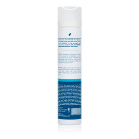 SUDZZFX Whipped Creme & Honey Volumizing Shampoo label close-up highlights sulfate-free formula.