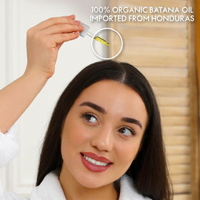 Close-up of batana oil in the glass dropper highlighting clarity.