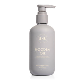 SUGARED + BRONZED Hocoba Oil bottle pour showing easy daily hydration.