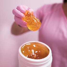 Sugaring NYC brand logo on packaging for trusted salon-quality