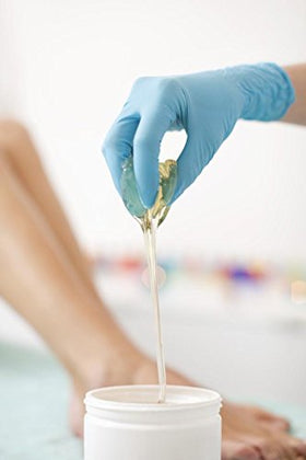 Sugaring paste tube and strips arranged neatly highlights included supplies