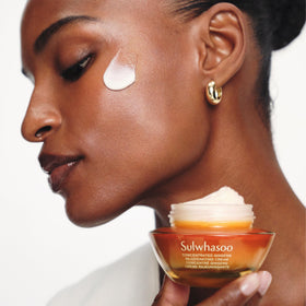 Graphic emphasis on ginseng actives and peptides in Sulwhasoo cream for anti-aging support.