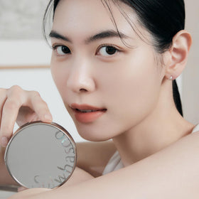 Sulwhasoo Perfecting Cushion SPF 46 Water Drop Puff in use for even application.