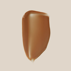 Swatch on skin reveals warm golden undertones for natural color blend.