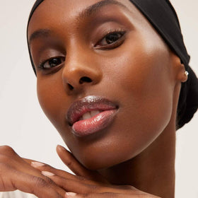 Open cap view of Summer Fridays Lip Butter Balm showing color