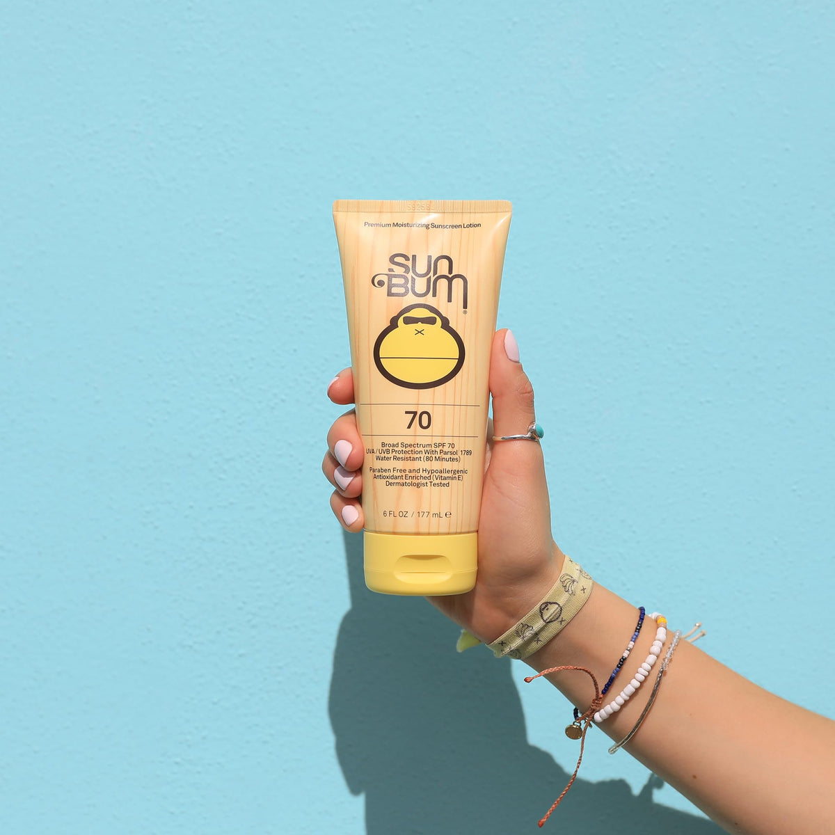 Sun Bum Original SPF 70 lotion label close-up, reef-friendly formula and paraben-free.