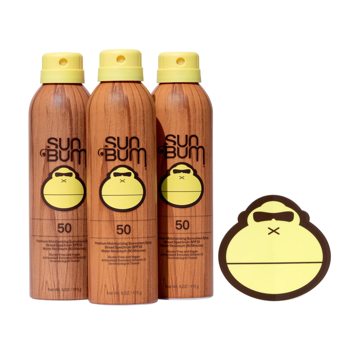 Sun Bum Original Sunscreen Spray bottle on the sand offering broad spectrum protection.