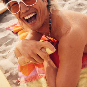 Close-up of the Sonny Sticker on the bottle for a fun beach vibe.