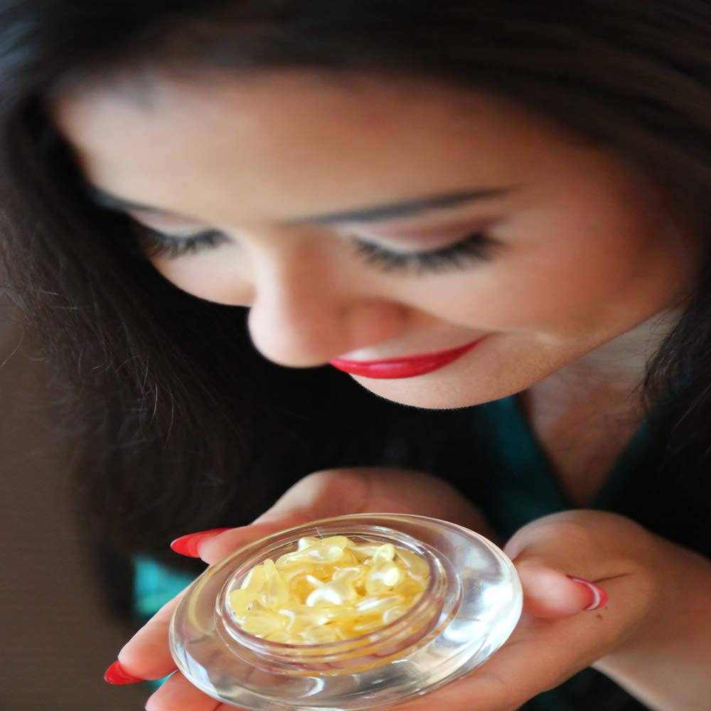 Texture close-up of SUN Ceramide C Capsules showing a smooth, non greasy finish