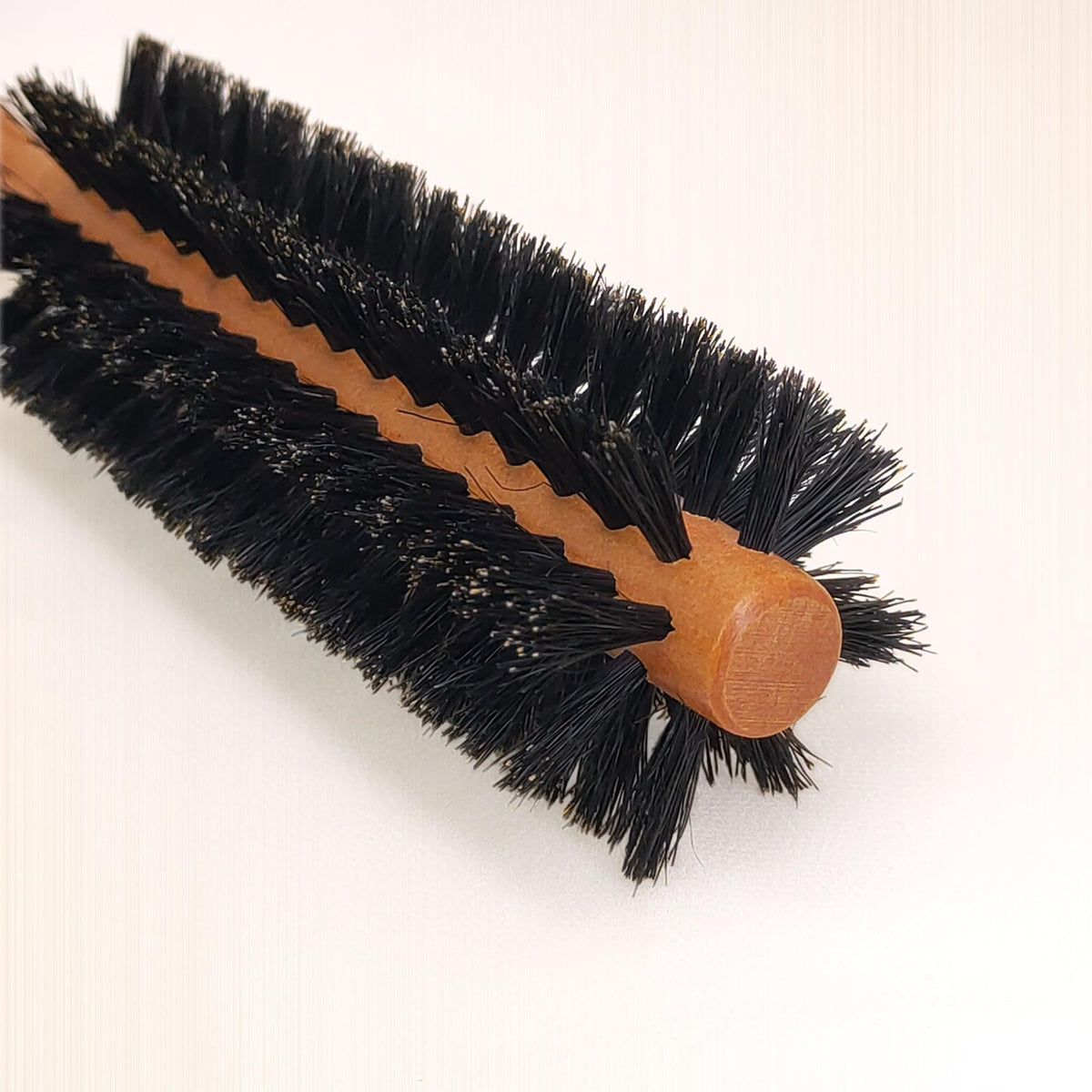 SUNBIRD compact brush for short, thin hair styling routines.