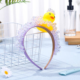 Suncalla headband close-up highlighting yellow and transparent bubble details for visual impact.