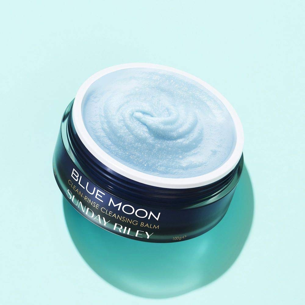 Blue Moon Cleansing Balm spread on hand shows creamy makeup-removal formula.