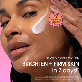 Sunday Riley CEO serum application on the cheek suggests radiant, even skin tone.