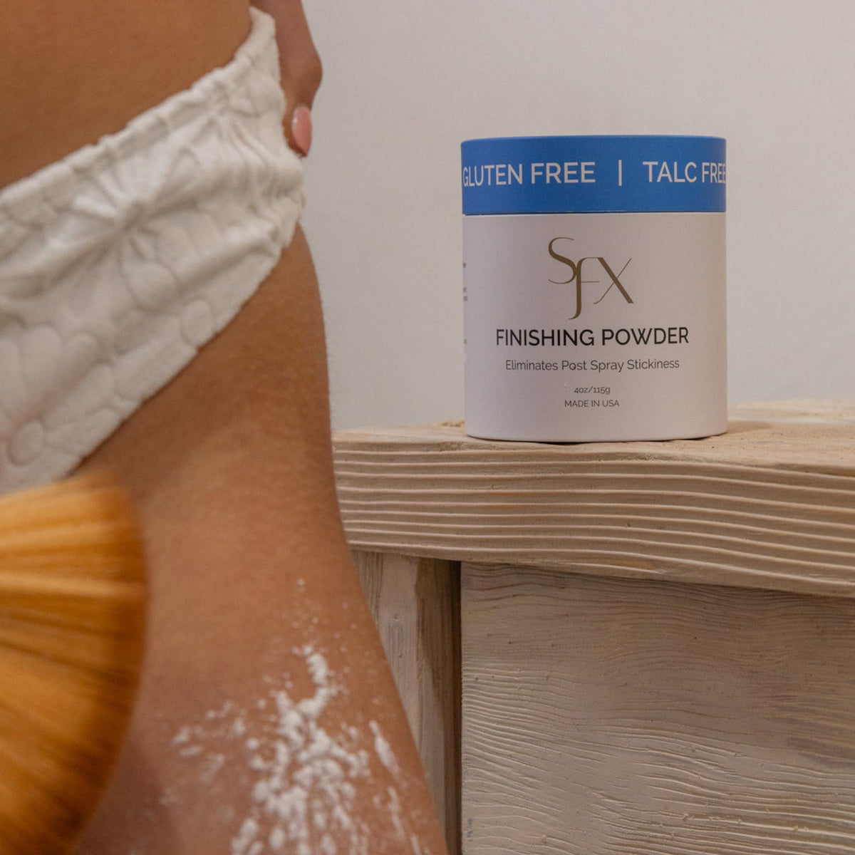 SunFX powder applied to knees, chest, and décolletage