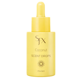 SunFX Scent Drops Coconut bottle in hand, perfect for customizing tan fragrance.