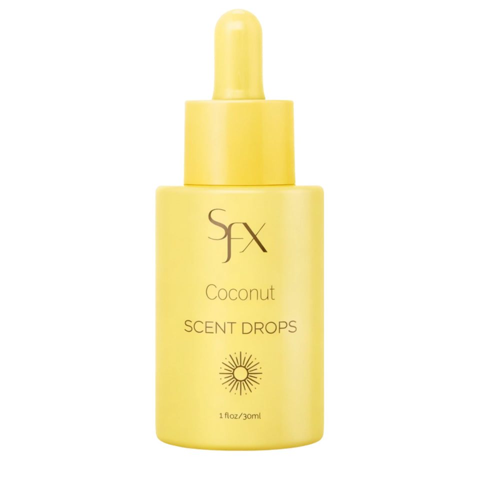 SunFX Scent Drops Coconut bottle in hand, perfect for customizing tan fragrance.