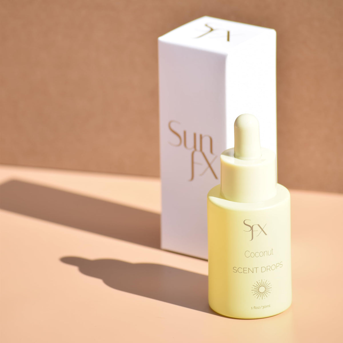 SunFX Scent Drops Coconut pour shows simple dropper use in salons.