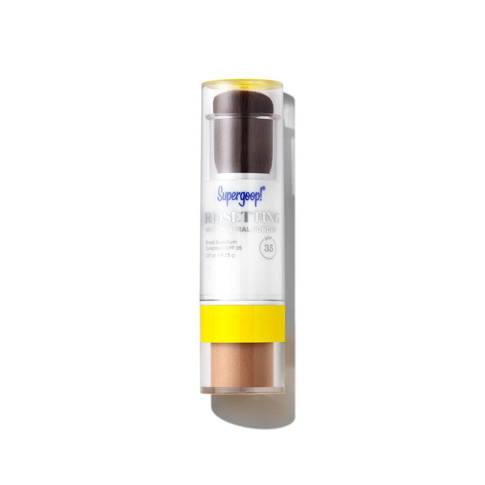 Supergoop! Resetting Powder bottle close-up for on-the-go SPF and makeup setting.