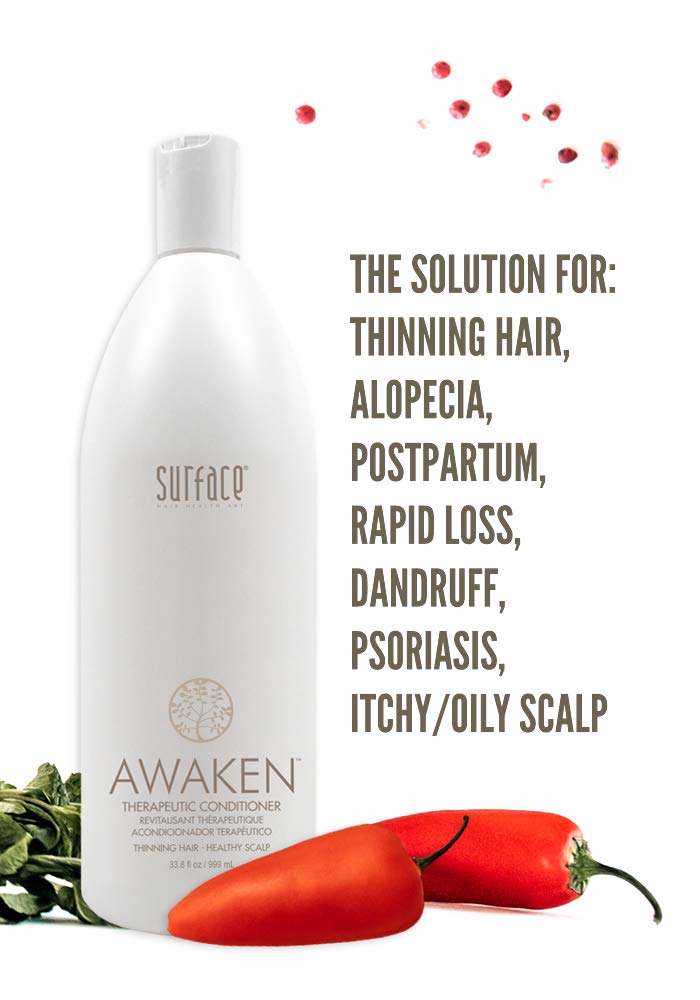 Pouring SURFACE Awaken conditioner onto damp hair to stimulate the scalp