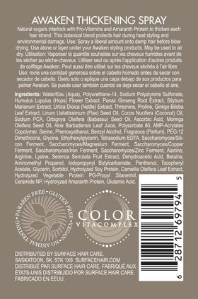 Surface Awaken Thickening Spray being dispensed on damp hair before blow-drying for volume.