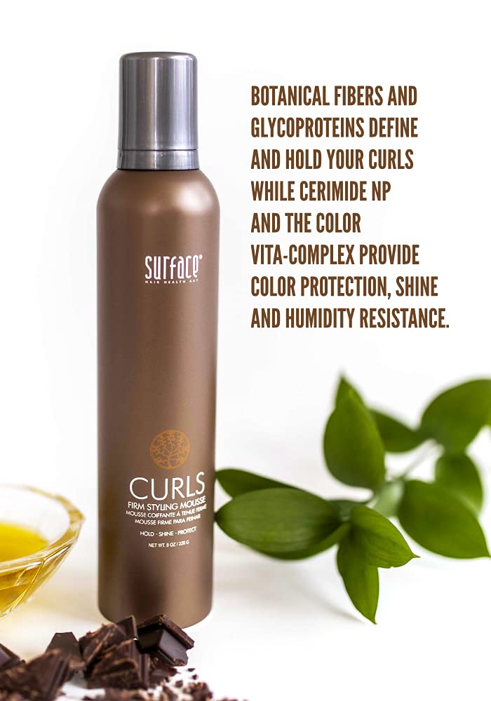 SURFACE Curls Firm Mousse on damp curls defines texture with frizz-free shine.