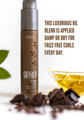 Surface Hair Curls Serum applied through curly hair for defined curls