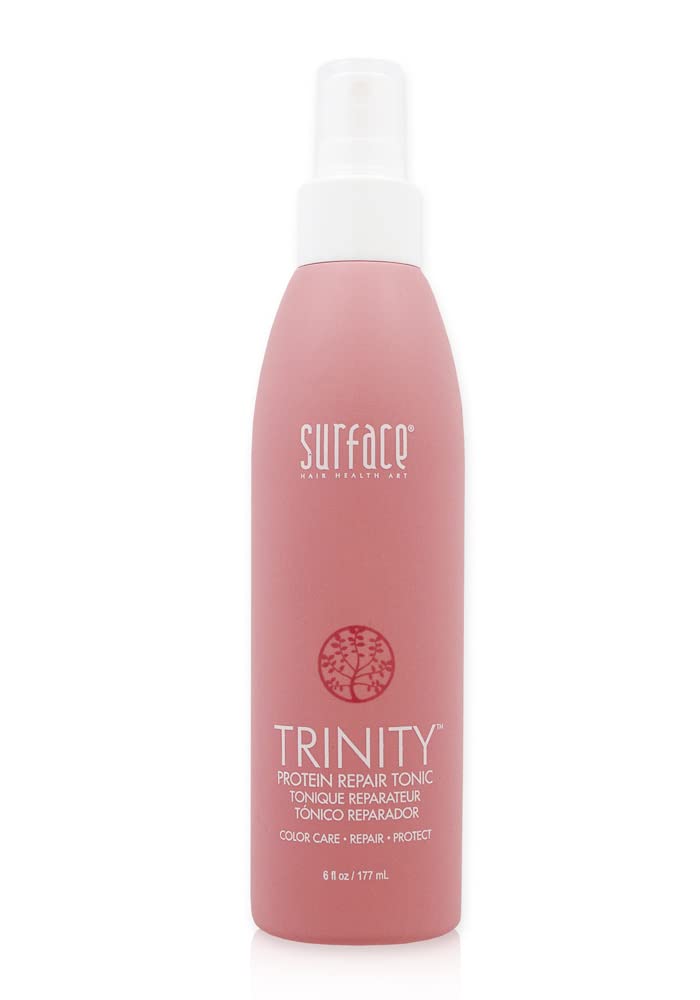 Surface Trinity Repair Tonic bottle enables easy spray application for damaged hair.