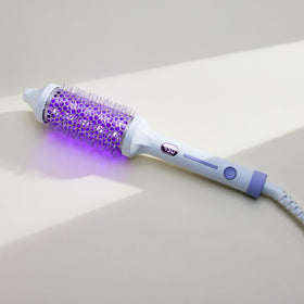 SUTRA Ultra Violet Thermal Brush ceramic barrel close-up highlighting smooth styling bristles.