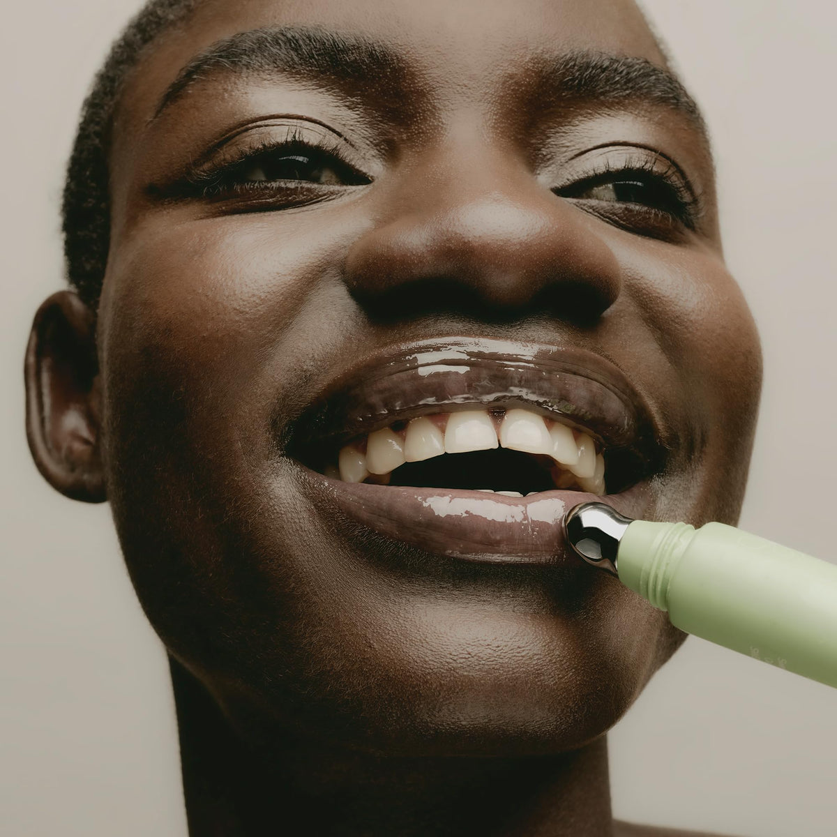 Applying SWEET JULY SKIN Lip Treatment yields natural shine