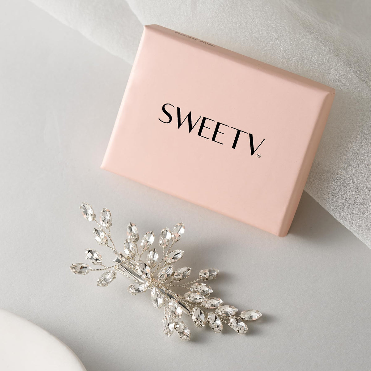 SWEETV handmade wedding hair piece showcases craftsmanship with sparkling crystals.