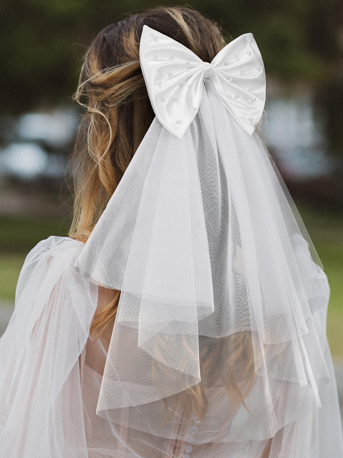 SweetV pearl-embellished bow detail adds a luxurious touch to updos.