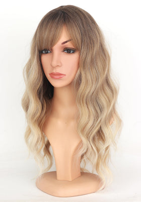 SYMEIW close-up texture of the ombre dirty blonde wavy wig with bangs.