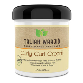 Taliah Waajid Extreme Curl Definition Gel is being applied for frizz control.