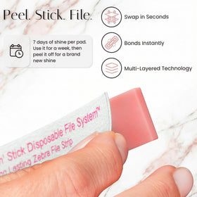 Tammy Taylor 100/180 grit file close-up showing refillable abrasive strips for long-lasting use.