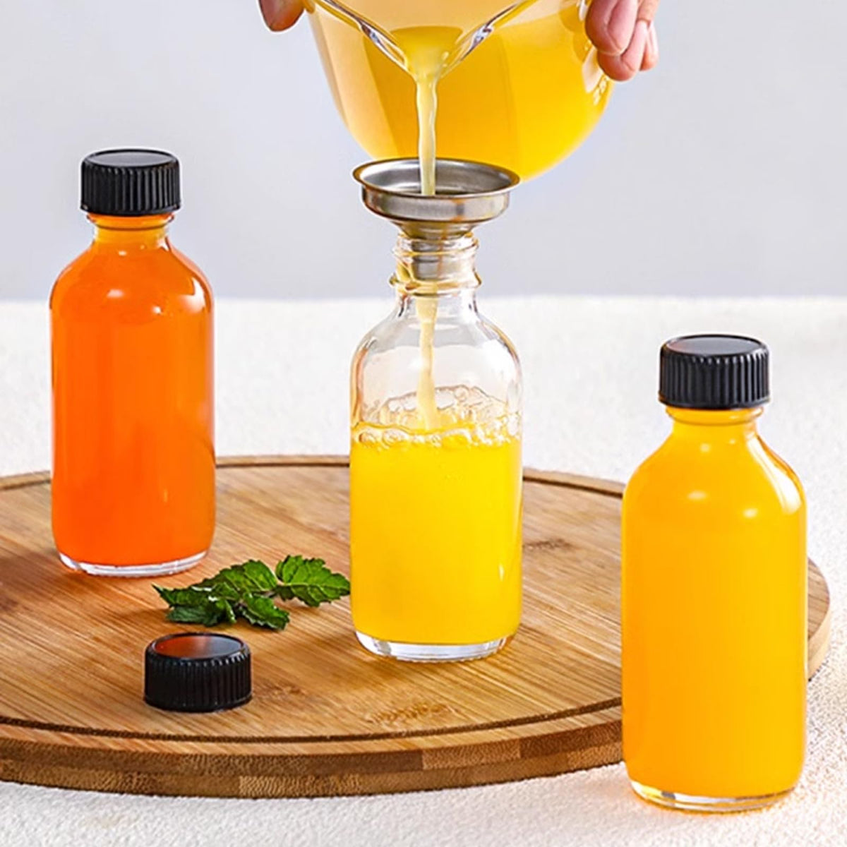 TANEMUDO essential oil bottle close-up with clear glass and airtight cap