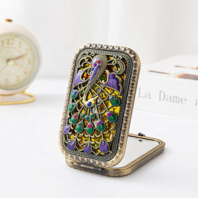 Tang Song pocket mirror with lifelike peacock detail for daily use