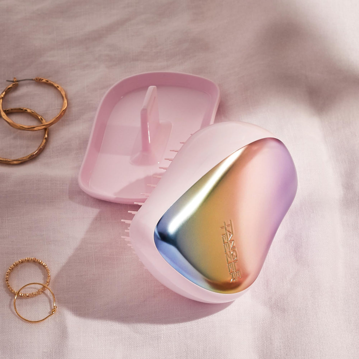 Travel-friendly Compact Styler fits in bag for quick touch-ups