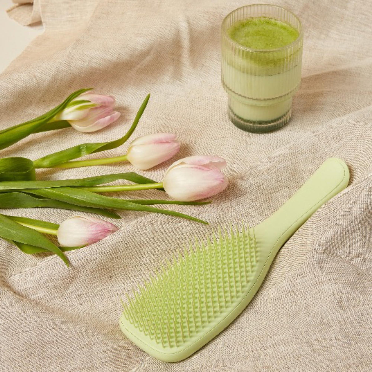 Tangle Teezer Matcha Green conditioner distribution in the shower for silky results.