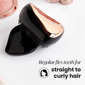 Tangle Teezer Compact Styler shown on wet hair for effective detangling