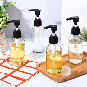 Tanlade glass apothecary bottles with pumps showcase durable thick glass material.